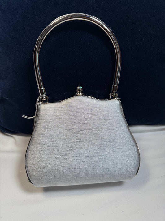 Small Evening Purse w/Clasp. Silver Fabric with Silvertone Metal Handle.
