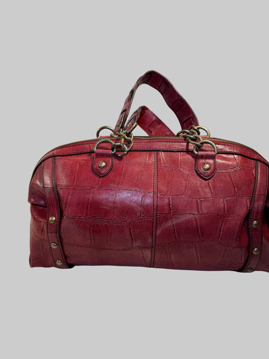 Pre-owned. Good condition. Burgundy duffle bag w/chain link straps