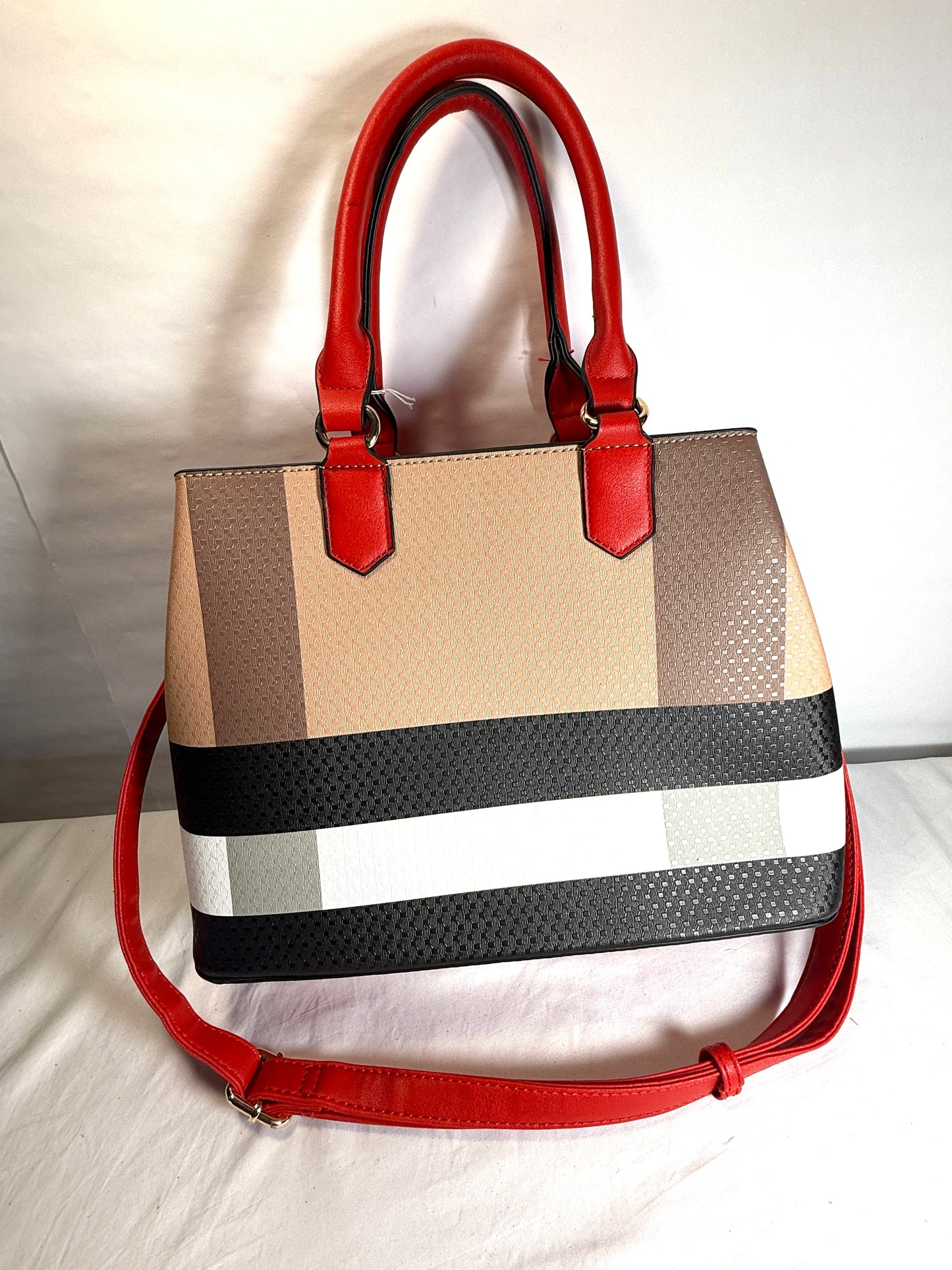 Plaid tote handbag with adjustable strap.