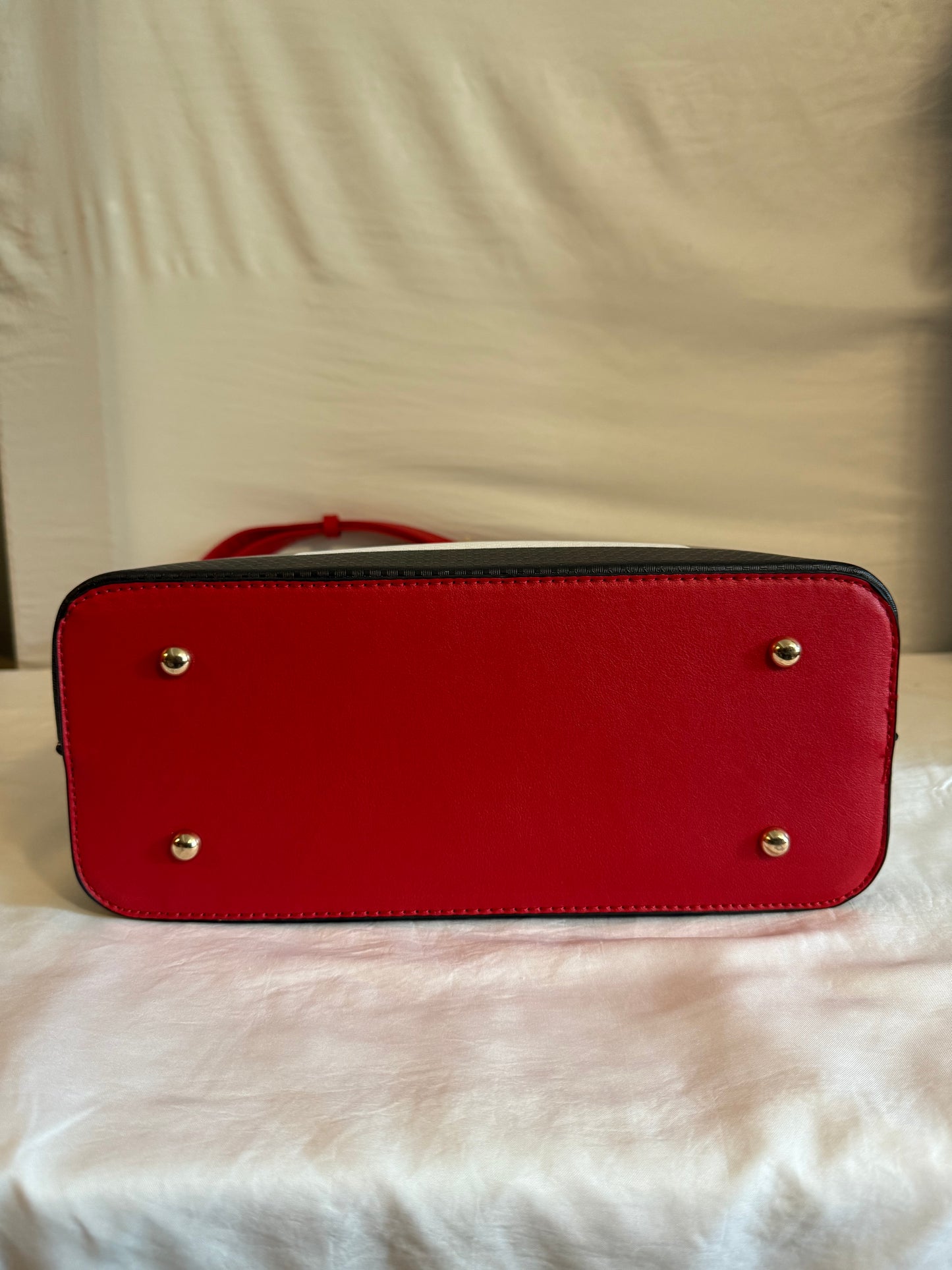 Plaid tote handbag with adjustable strap.