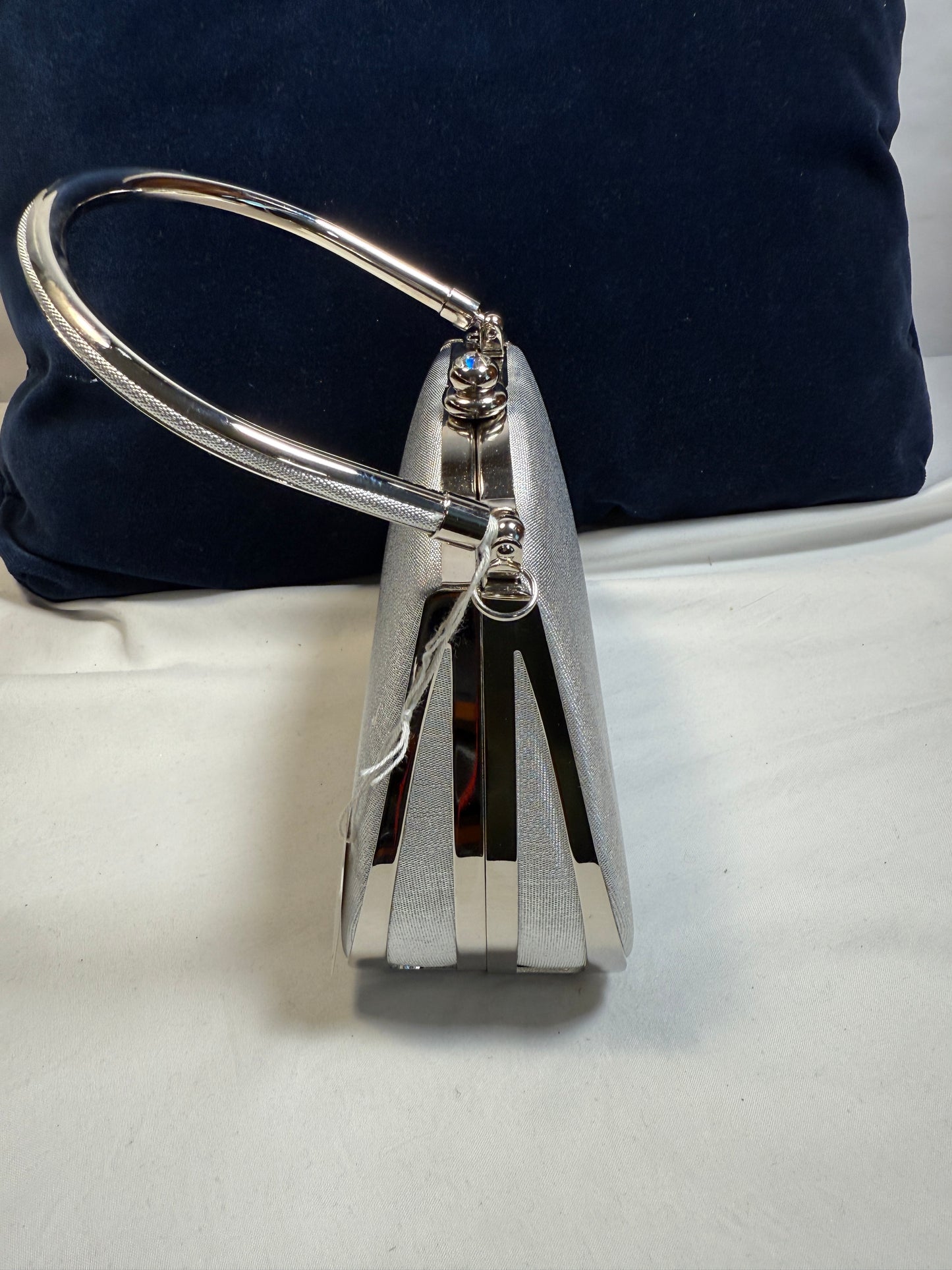 Small Evening Purse w/Clasp. Silver Fabric with Silvertone Metal Handle.