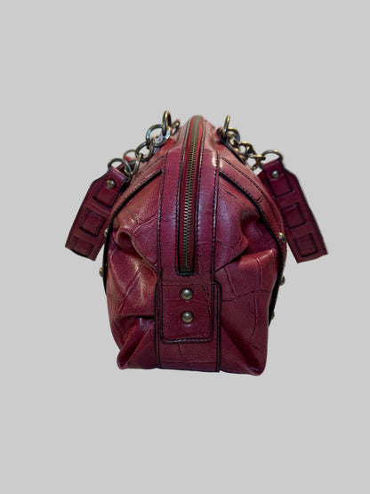 Pre-owned. Good condition. Burgundy duffle bag w/chain link straps
