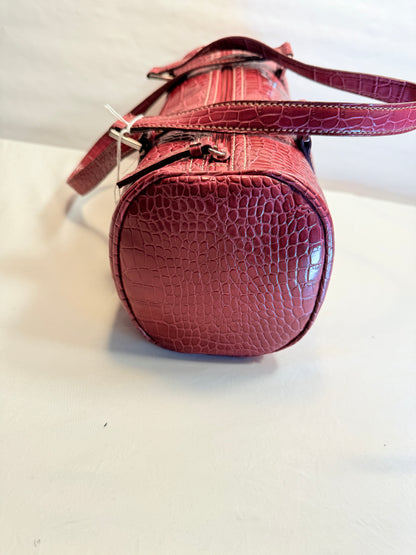Pre-owned Crocodile-embossed burgundy patent leather barrel bag with silver-tone zipper closure.