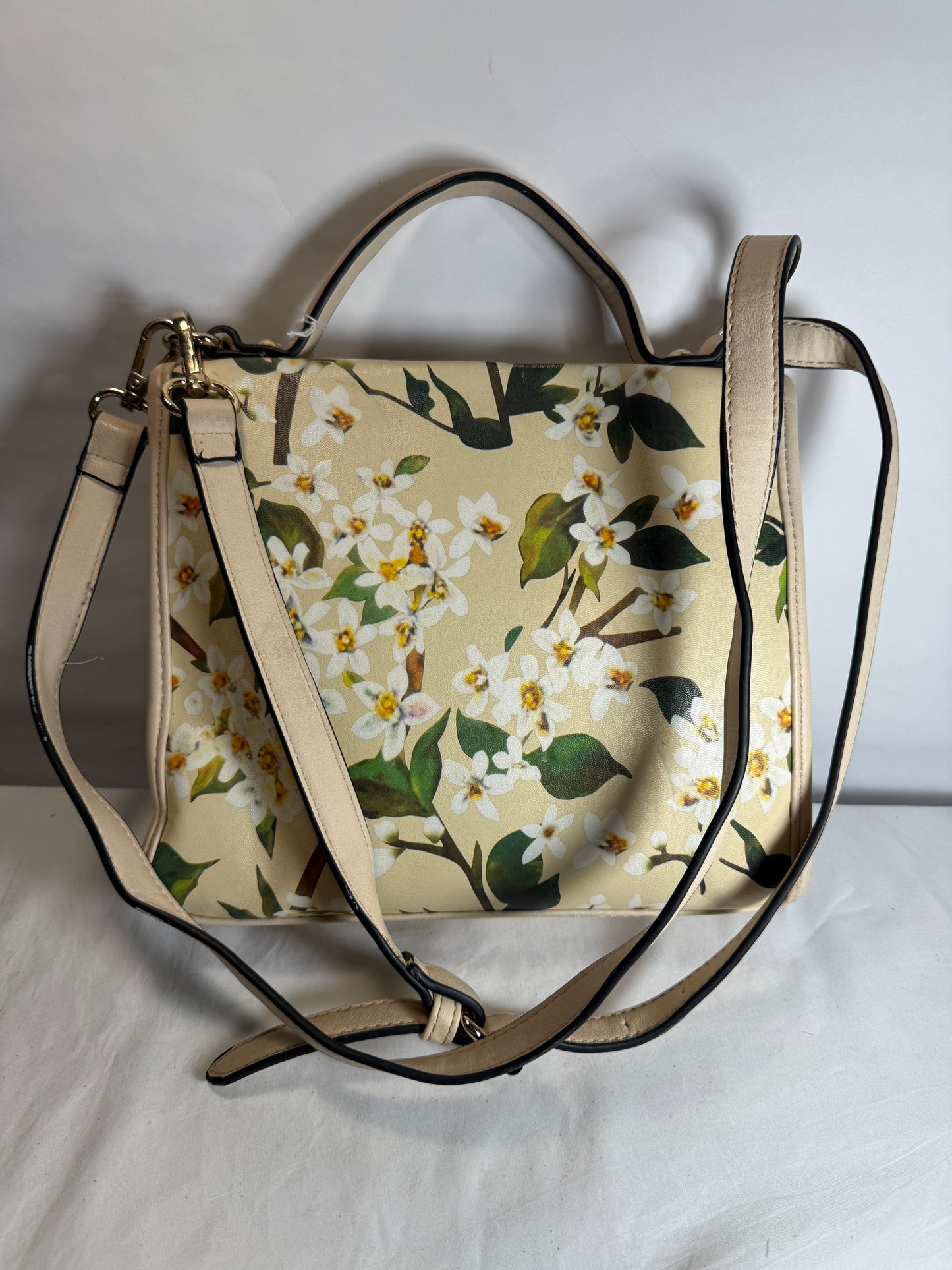 Pre-owned. Light women's small handbag with a blooming spring print. 
