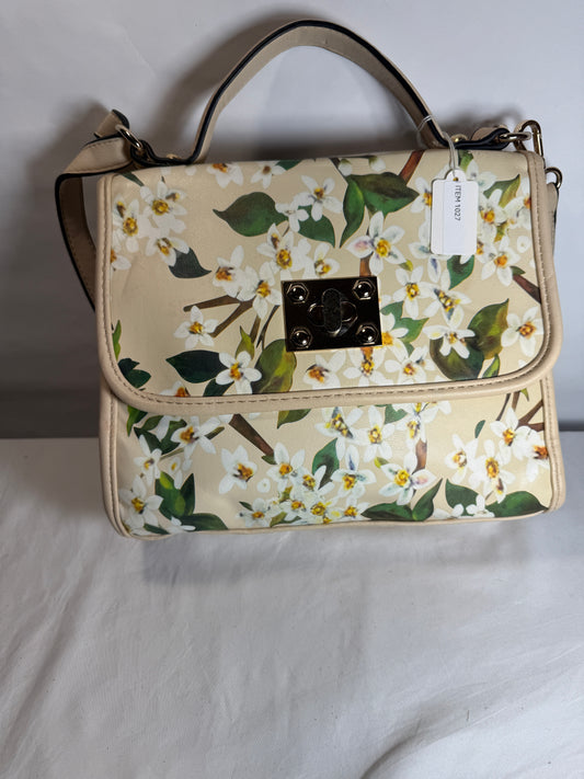 Pre-owned. Light women's small handbag with a blooming spring print. 