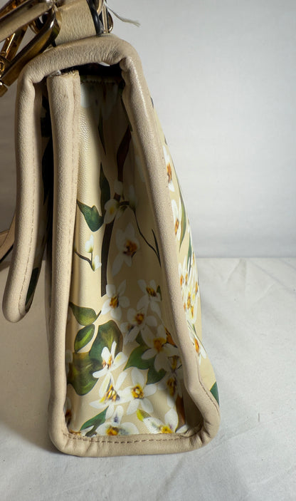Pre-owned. Light women's small handbag with a blooming spring print. 