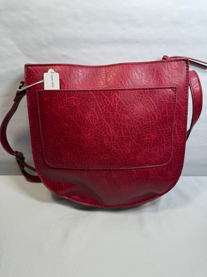 Crossbody Red Faux leather bag w/adjustable strap and side pocket.