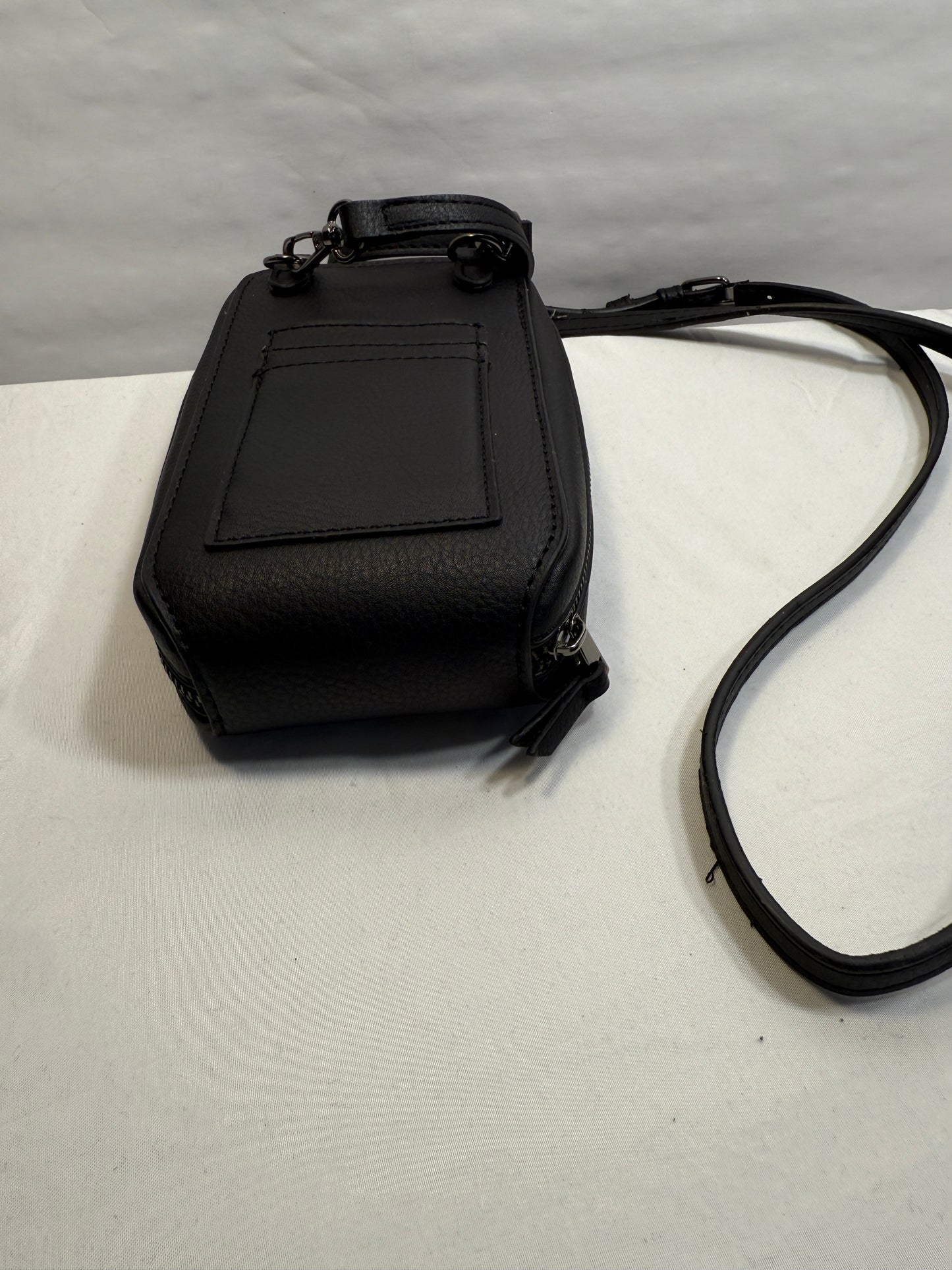 Zip Around Phone Crossbody bag w/ Adjustable Strap and Silver Hardware.