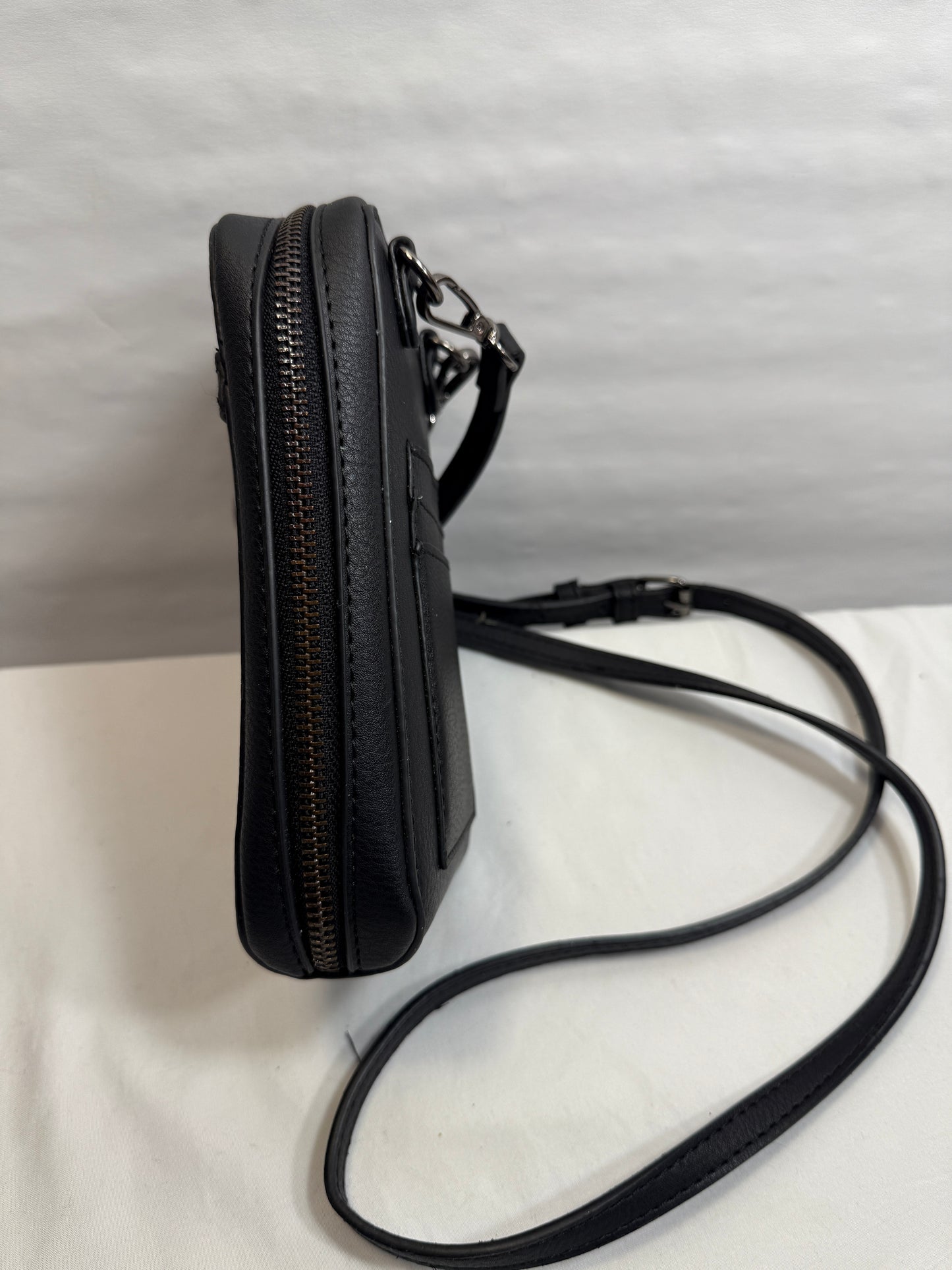 Zip Around Phone Crossbody bag w/ Adjustable Strap and Silver Hardware.