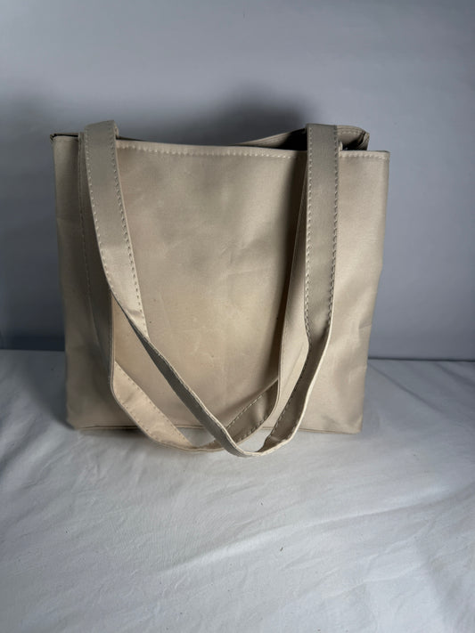 Pre-owned beige cargo style bag. 100% Polyester. Multi-Pocket Tote Bag