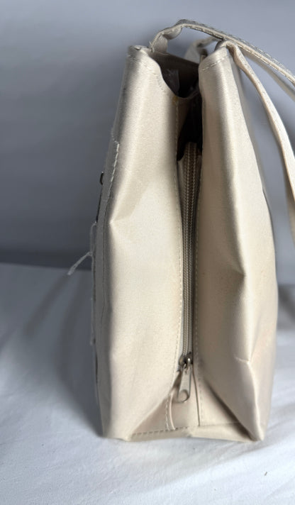Pre-owned beige cargo style bag. 100% Polyester. Multi-Pocket Tote Bag